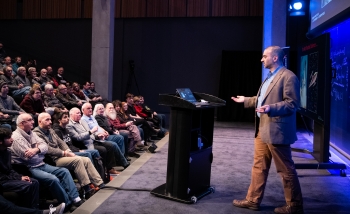 Man speaking in front of audience