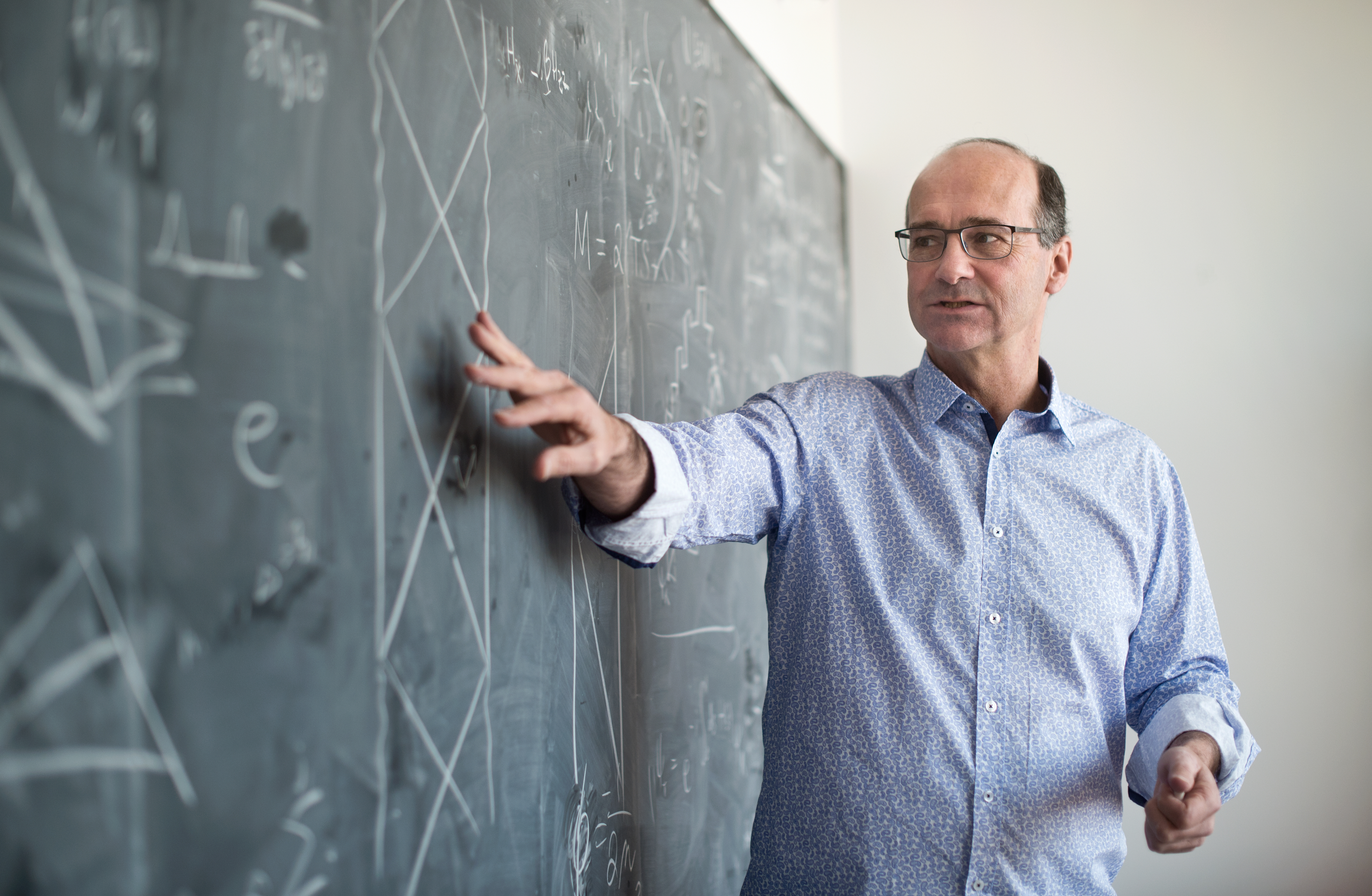 Rob Myers explaining a result on a chalkboard