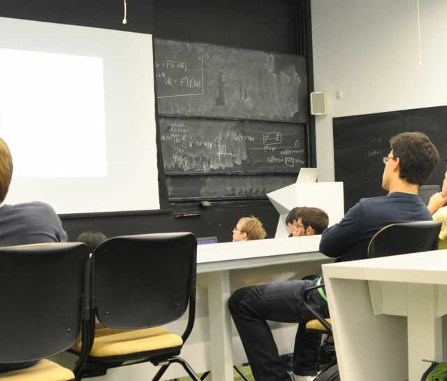 Students in a lecture hall listening to a seminar