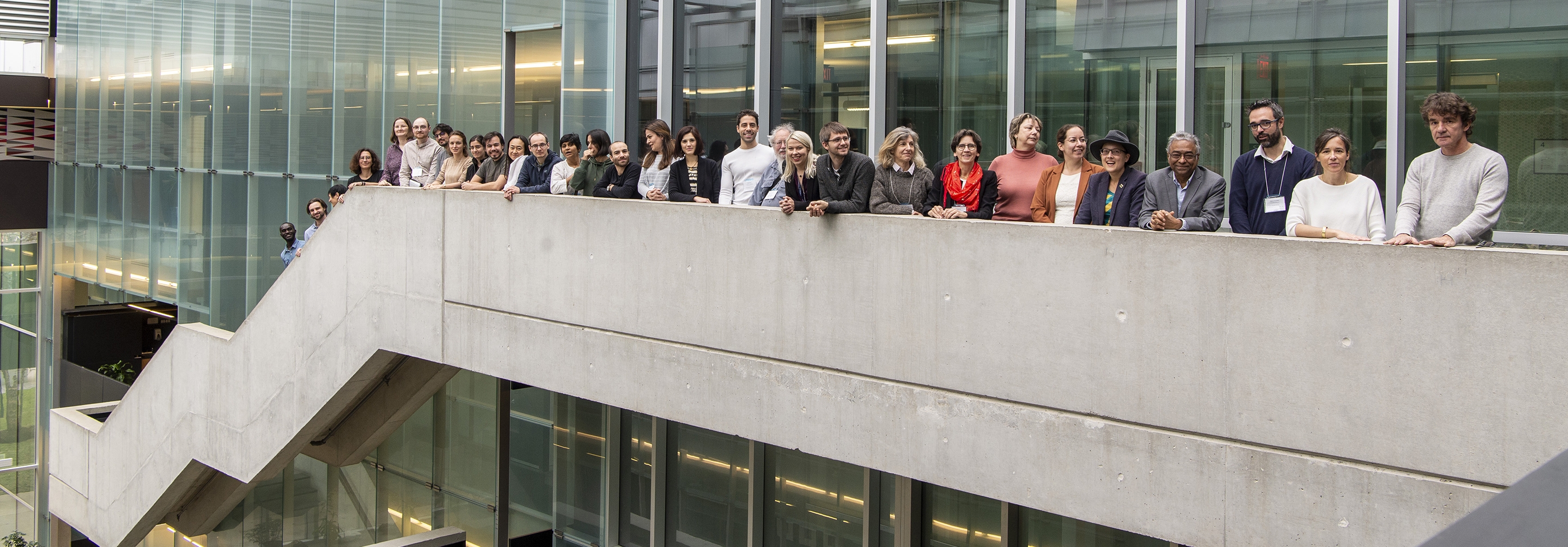 Group of people standing in a row along a staircase